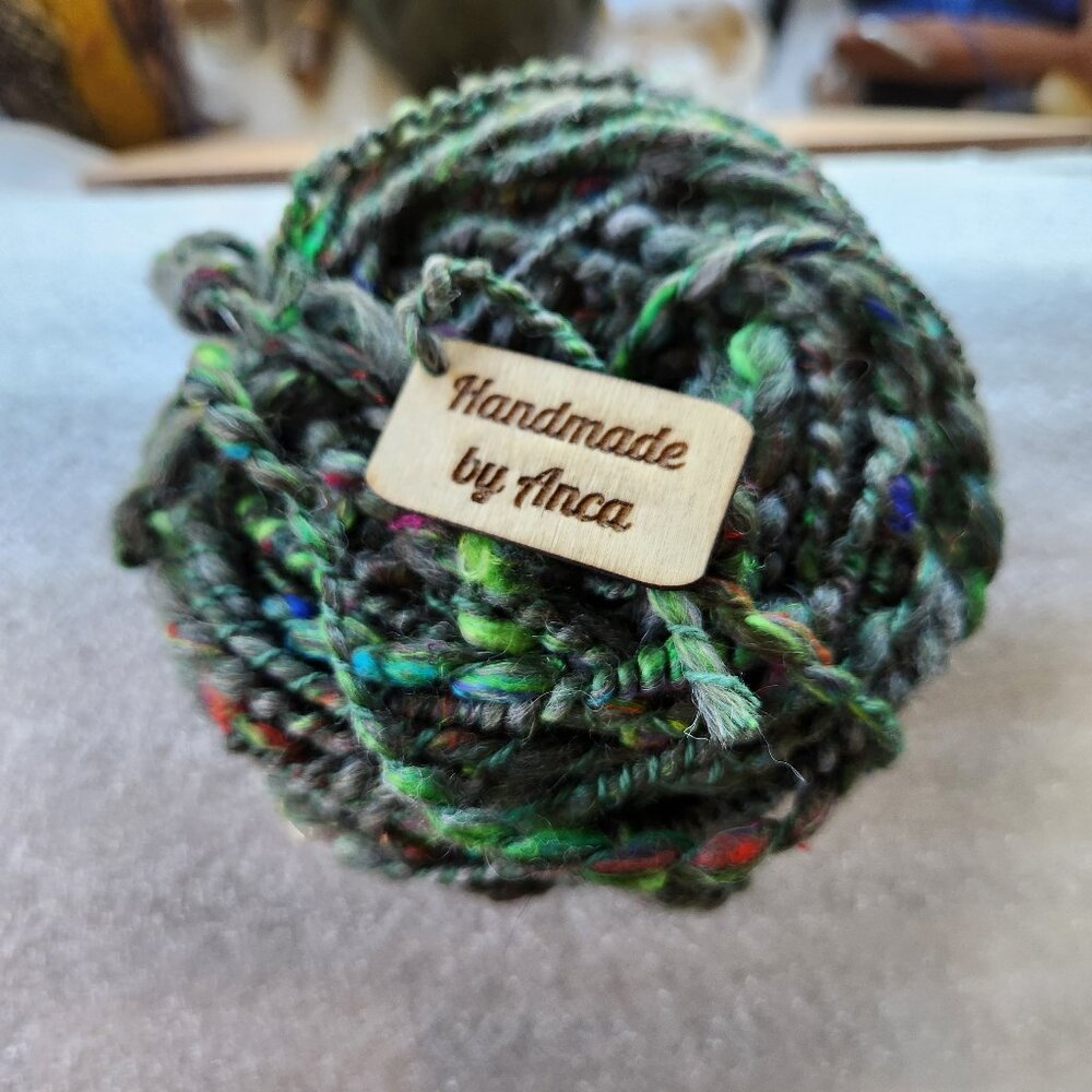 Yarn, art yarn, new, hand spun 2.1 oz. in shades of green, fine wool.